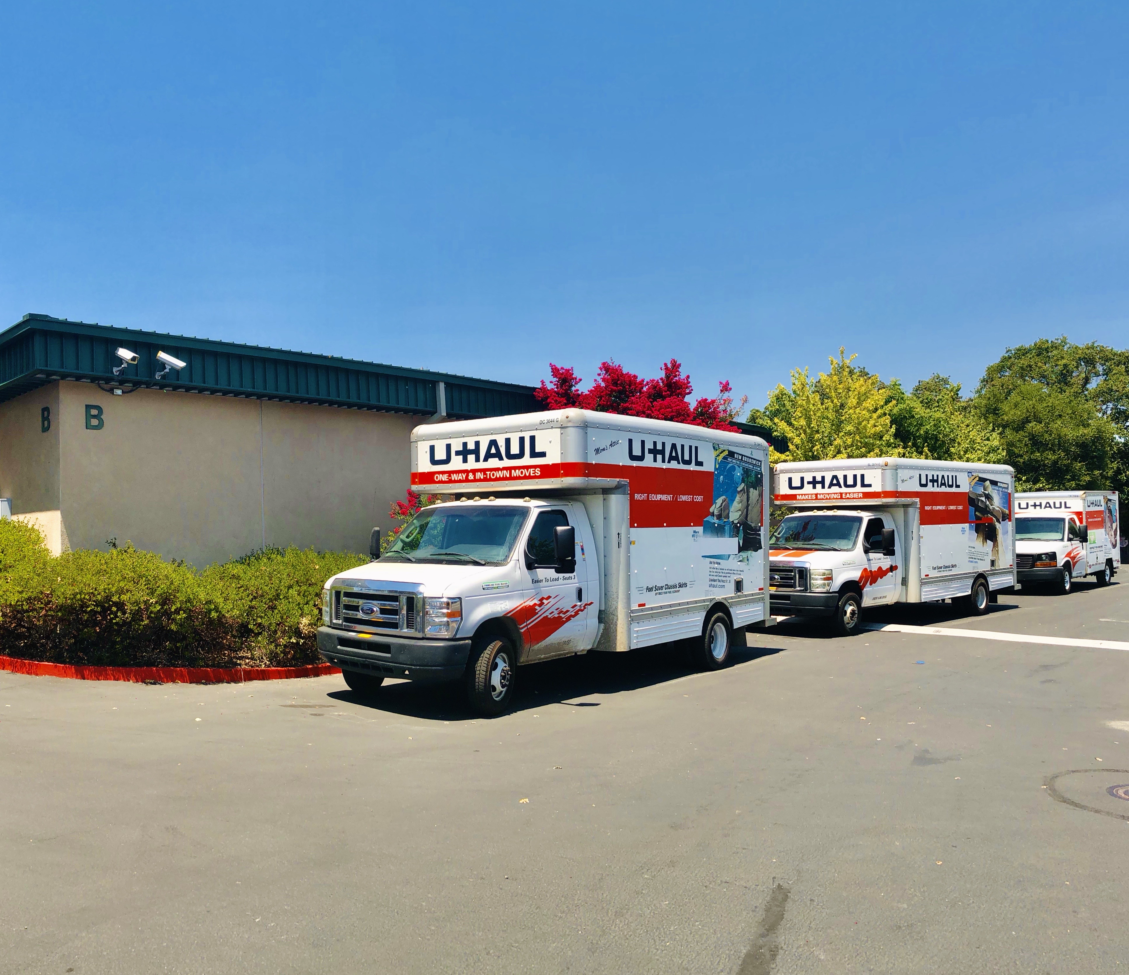 Moving trucks parked at facility